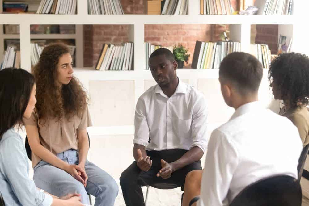 Millennials in group therapy for addiction treatment.|addiction among millennials|